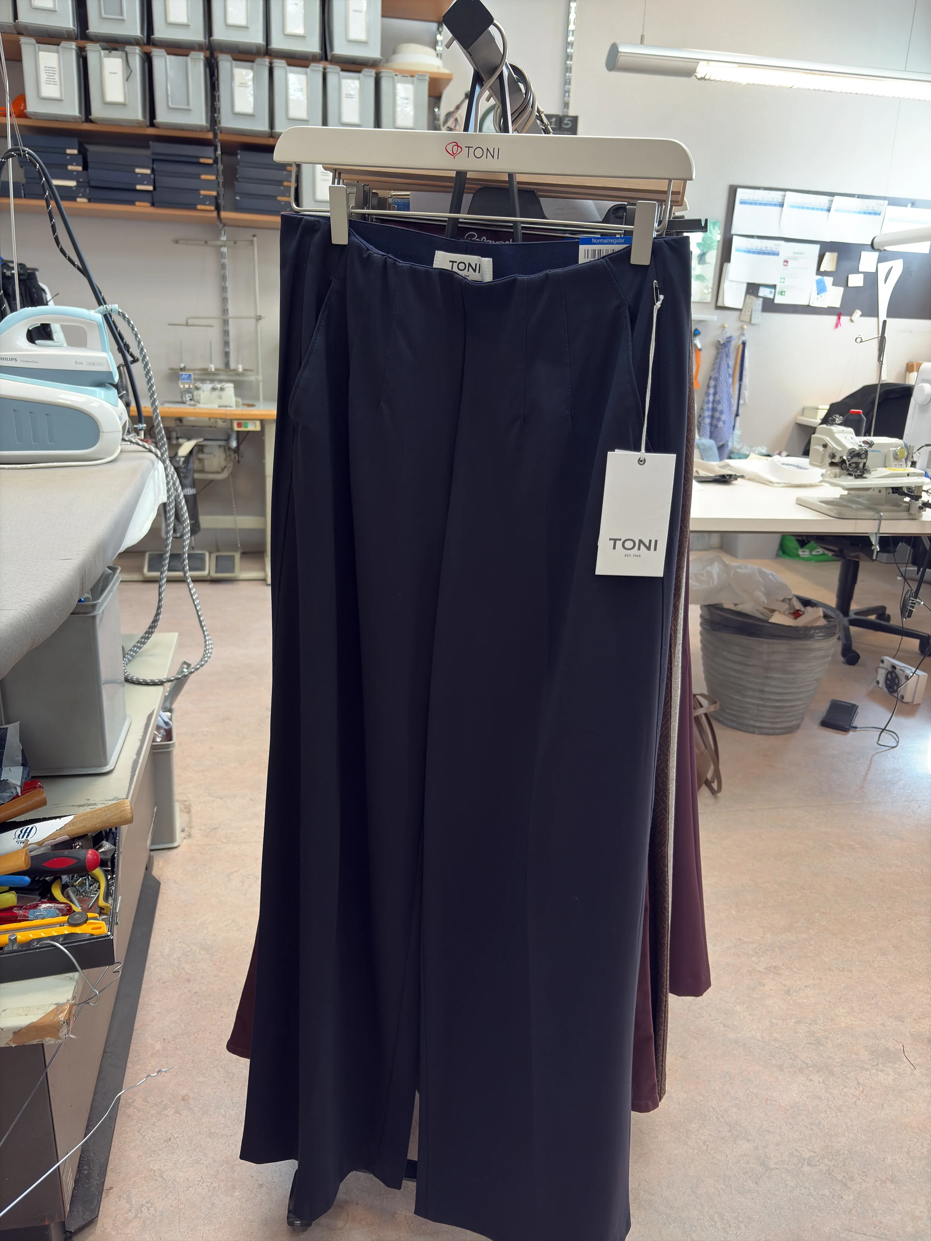 The same pants on the rack, as the photo came in