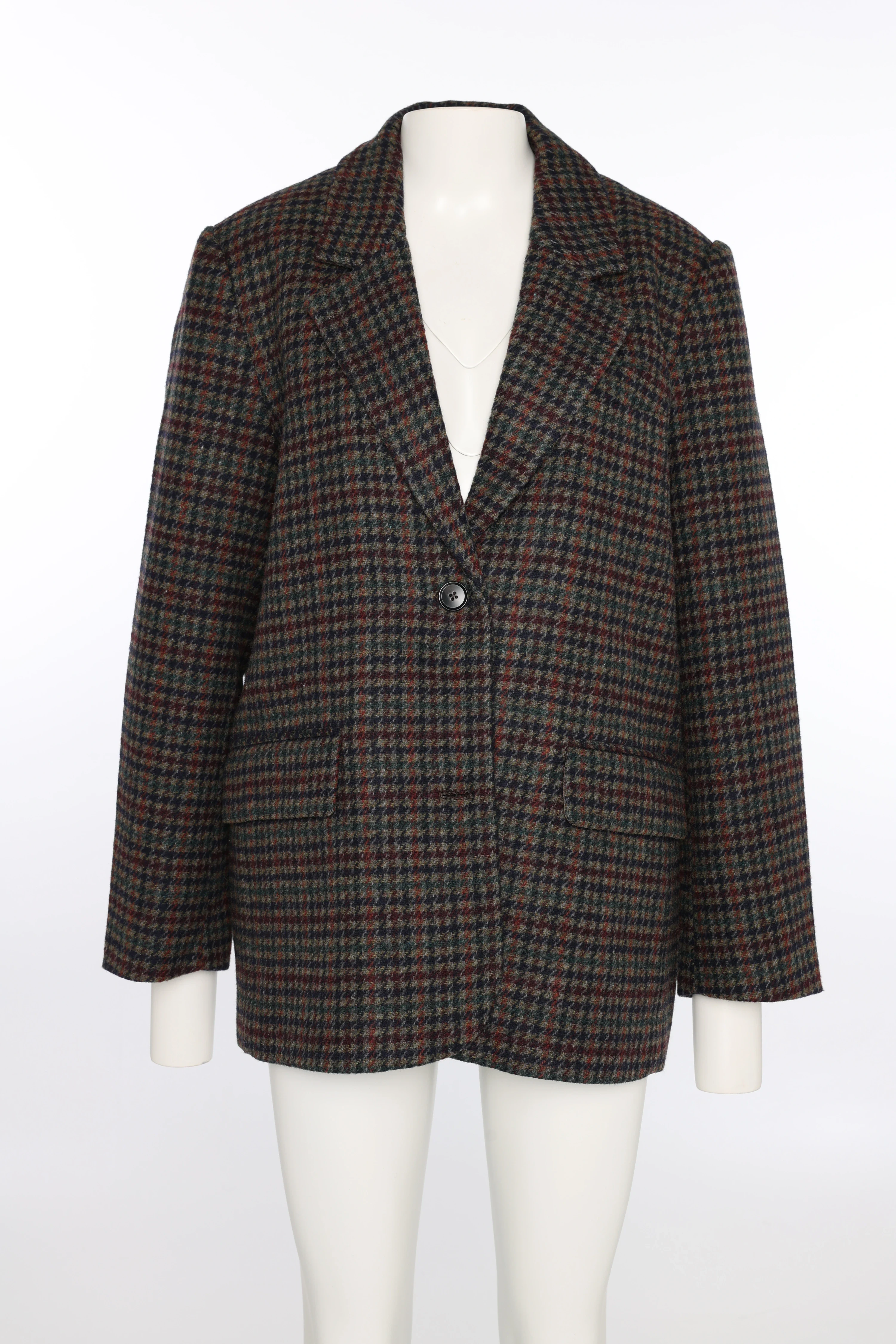 Checkered blazer on a dress form in the studio