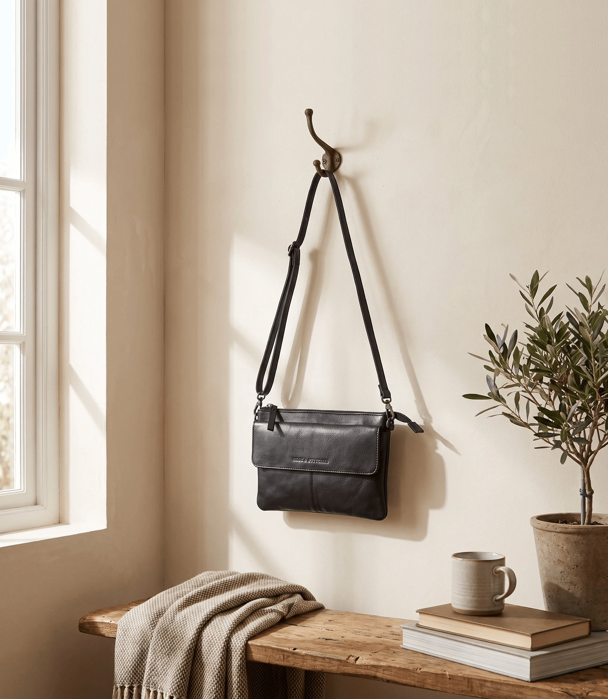 Black Hide & Stitches shoulder bag believably to scale in a light interior
