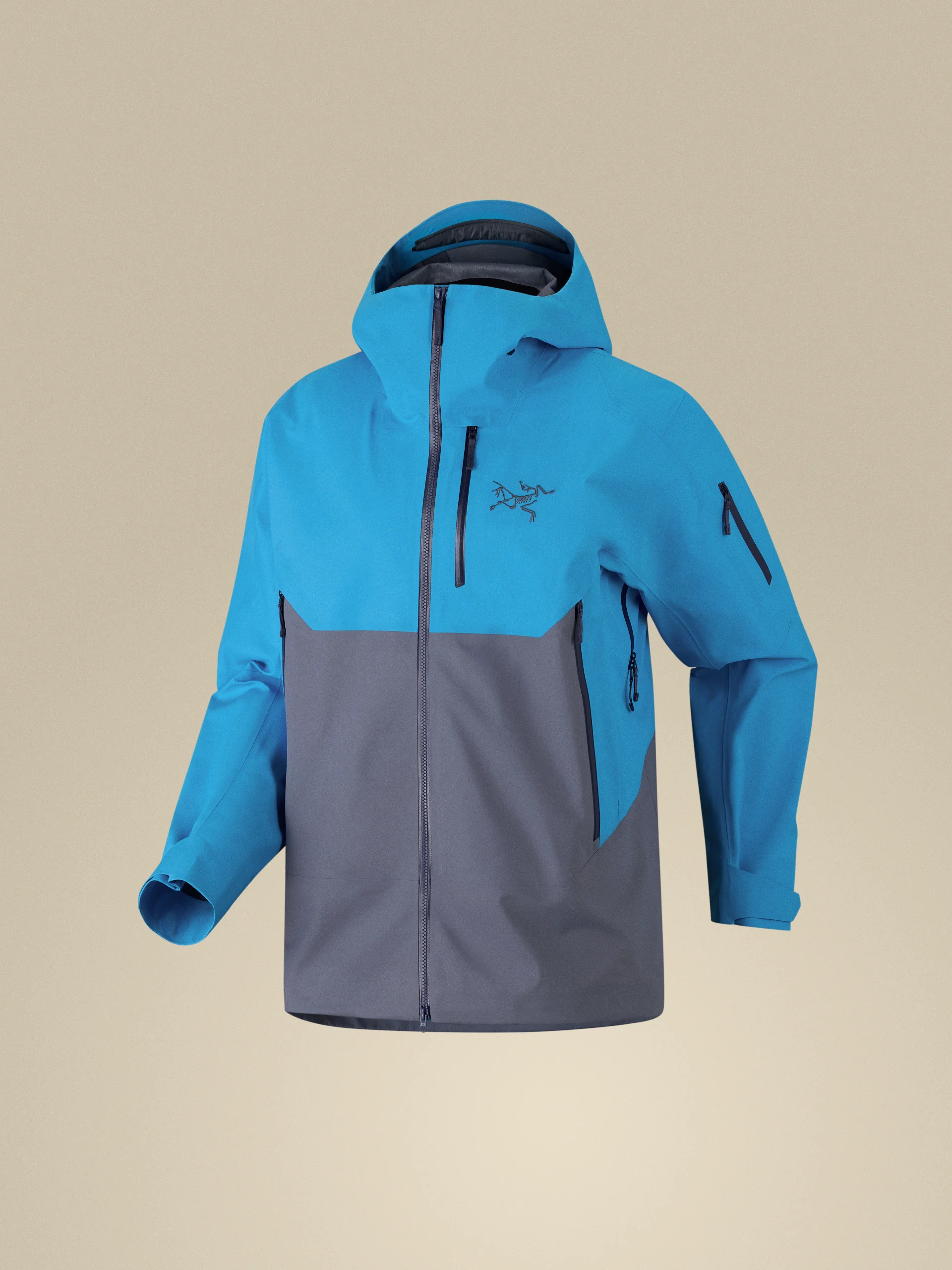 Blue-gray ski jacket on a sand-colored background, as supplied by the vendor
