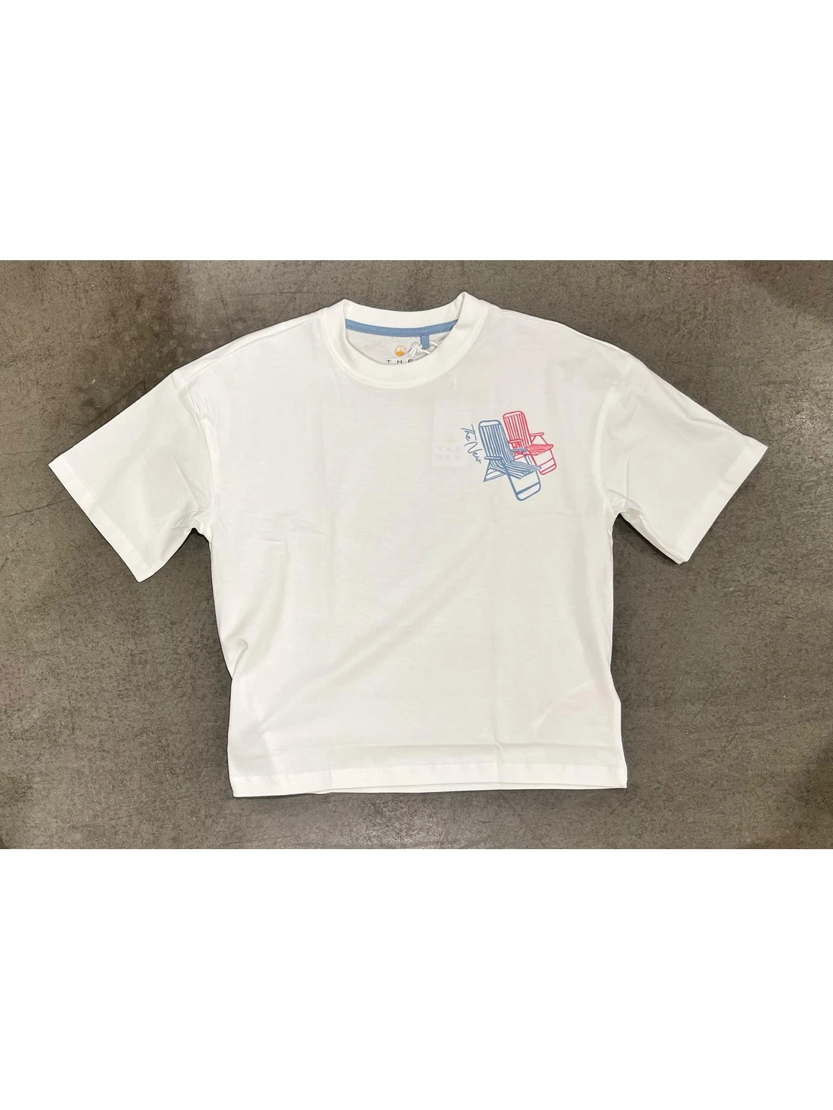 T-shirt photographed flat on studio background
